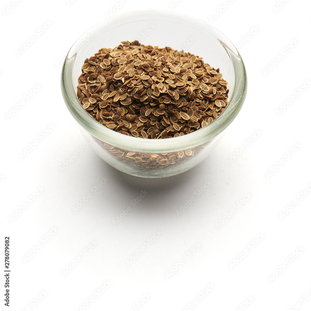 dill seeds isolated in a glass plate dill seeds isolated in a glass plate