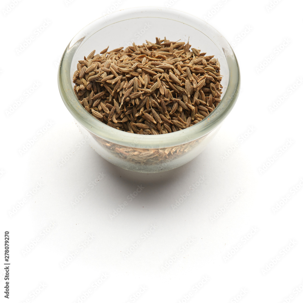 Zira Iranian seeds isolated in a glass plate Zira Iranian seeds isolated in a glass plate