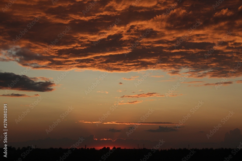 dark orange background color - cloudy sky structure at sunset