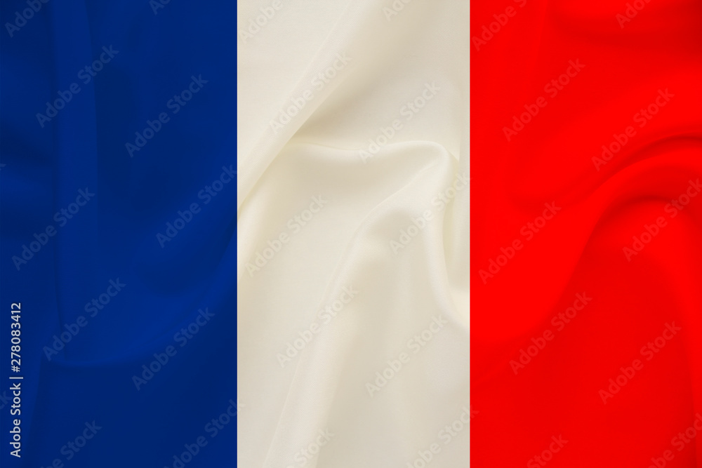 national flag of the country france on gentle silk with wind folds, travel concept, immigration, politics, copy space, close-up