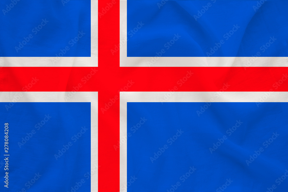 Obraz premium national flag of the country iceland on delicate silk with creases from the wind, concept of travel, immigration, politics, copy space, close-up
