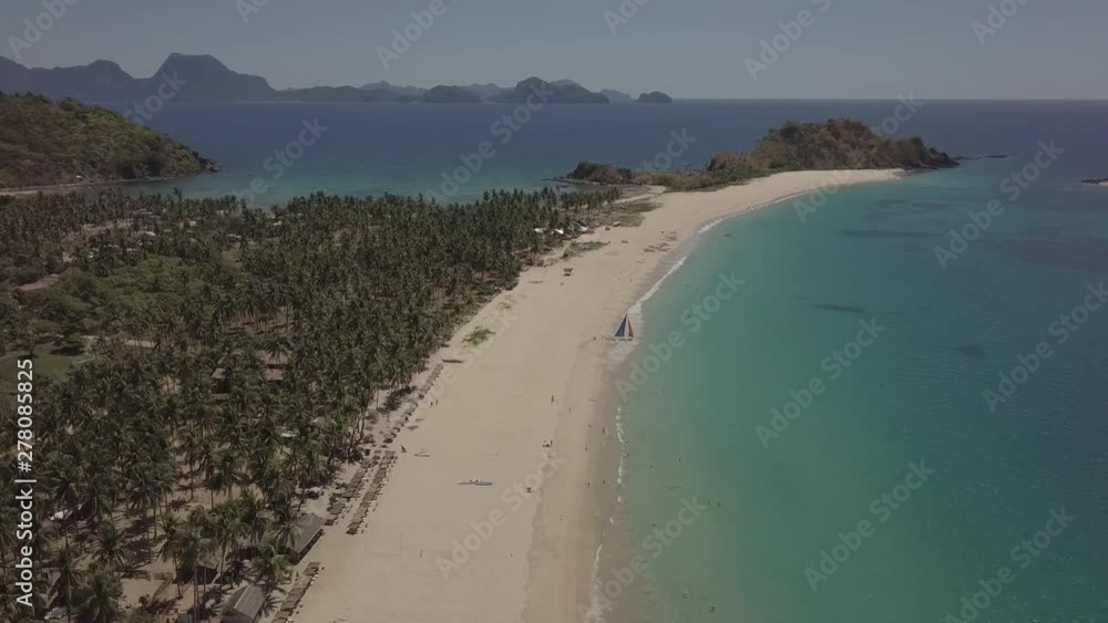 Aerial flyover shot showing Nacpan Beach, El Nido, Palawan, The Philippines Aerial flyover shot showing Nacpan Beach, El Nido, Palawan, The Philippines
