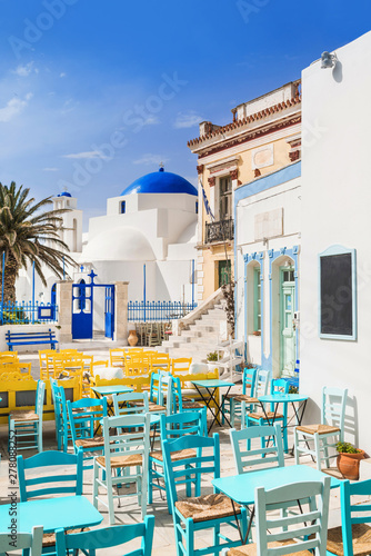 Traditional greek street with cafe tables in Serifos island, Cyclades, Greece 