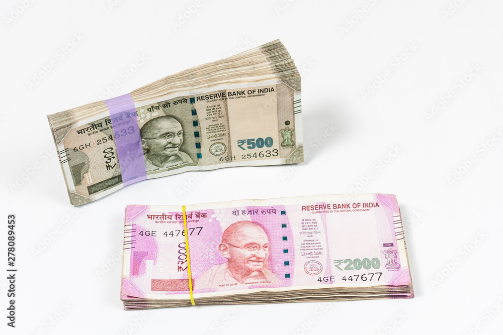 Bundles of Indian 500 and 2000 rupee notes in white background Bundles of Indian 500 and 2000 rupee notes in white background