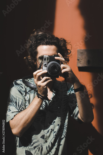 man with camera photo