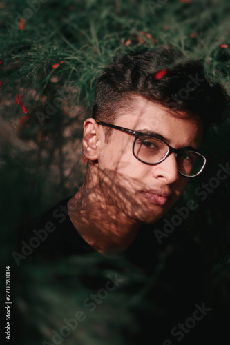 selective focus photography of man near green plant photo