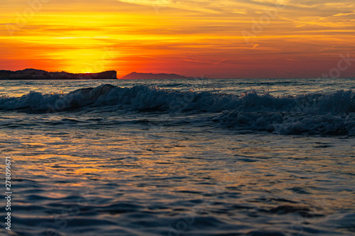 The setting sun turns the sky orange-red at Acharavi  Corfu  Greece