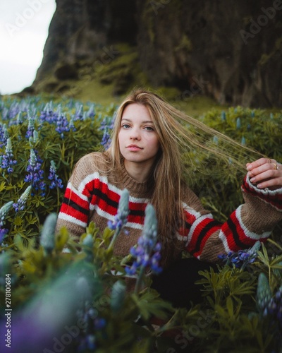 woman surrounded by flowers