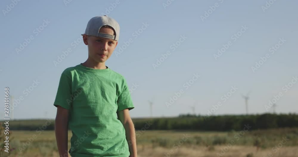 Boy standing in field Boy standing in field