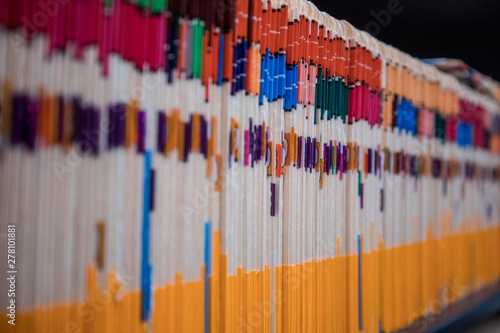A cabinet full of files in manila folders in an office space