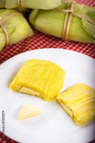 pamonha, Brazilian sweet made from homemade cheese with corn. Open pissing ready for consumption. Concept of traditional Brazilian sweet, typical food of the months of June and July.