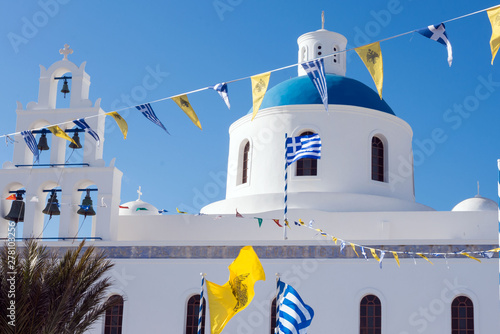 Beautiful island of Santorini, Greece. White Church with a blue dome in the village of Oia on the island of Santorini. Greek journey. The famous blue domes of Santorini.