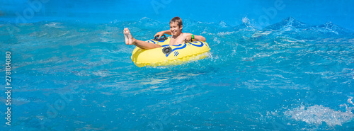 Banner with laughing teenager in amusement park