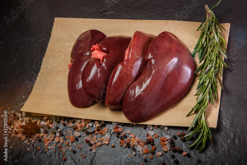 top view on group of raw pork kidneys served on craft paper