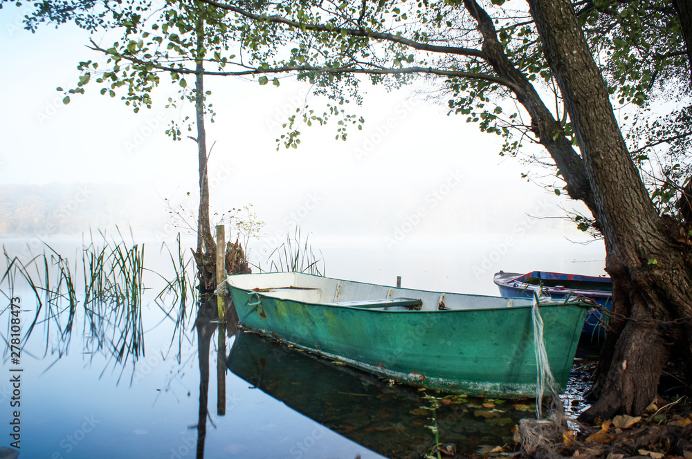 boat on the foggy lake