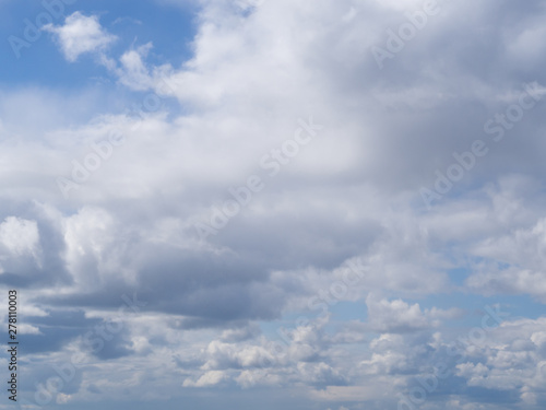 white clouds against a blue sky, abstract illustration