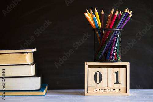 1 September concept postcard, teachers day, back to school, supplies. Calendar set on 1st september date photo