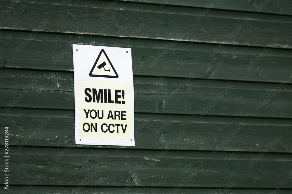 Smile you are on CCTV sign