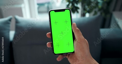 Man holding prekeyed smartphone and touching screen, template for advertisement, POV