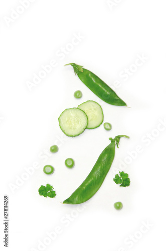 Wallpaper Mural peas and sliced cucumber and parsley on white background Torontodigital.ca