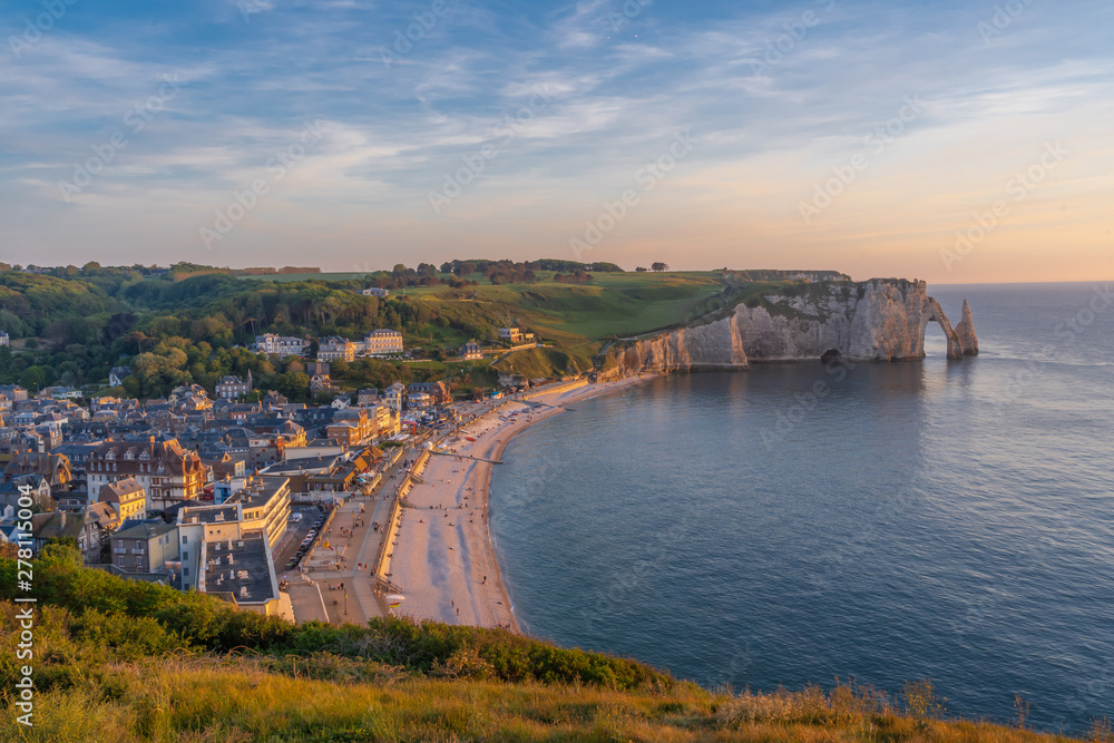 Etretat, France - 05 31 2019: Panoramic view of the cliffs of Etretat and the city at sunset