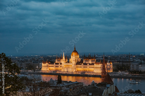 Budapest parliament night yellow illumination river bank