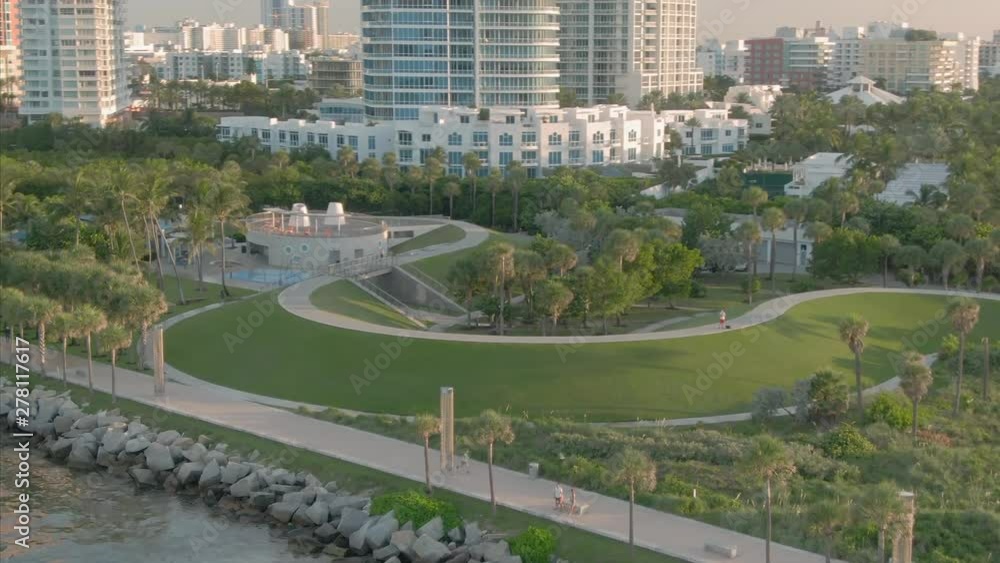 Aerial over South Pointe Park Pier & South Beach at sunrise. In the background is condominiums. Miami. Florida, USA Aerial over South Pointe Park Pier & South Beach at sunrise. In the background is condominiums. Miami. Florida, USA