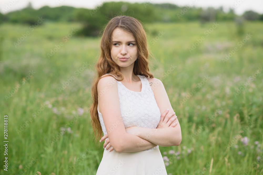 Beautiful young girl shows discontent in nature Beautiful young girl shows discontent in nature
