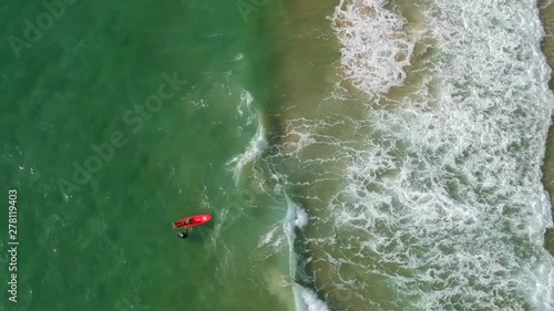 Beautiful view of from above surfers and waves