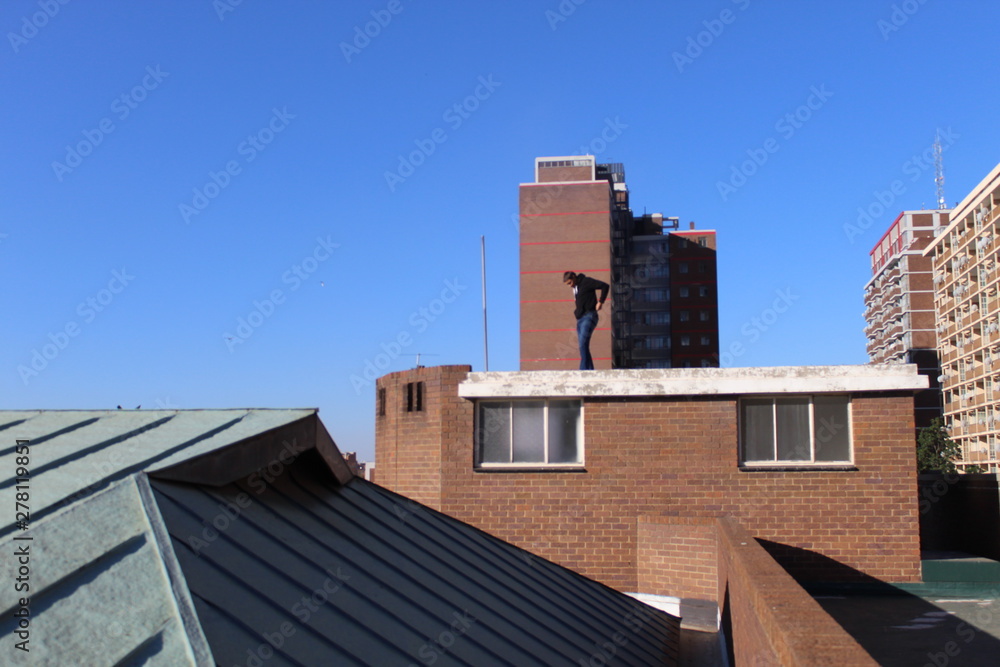 a man standing on the roof
