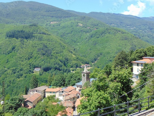 Wallpaper Mural Cutigliano, Tuscany, Italy. Top view of the town and the picturesque neighborhood. Beautiful nature and green mountains covered with forest, panorama, hillside. Torontodigital.ca
