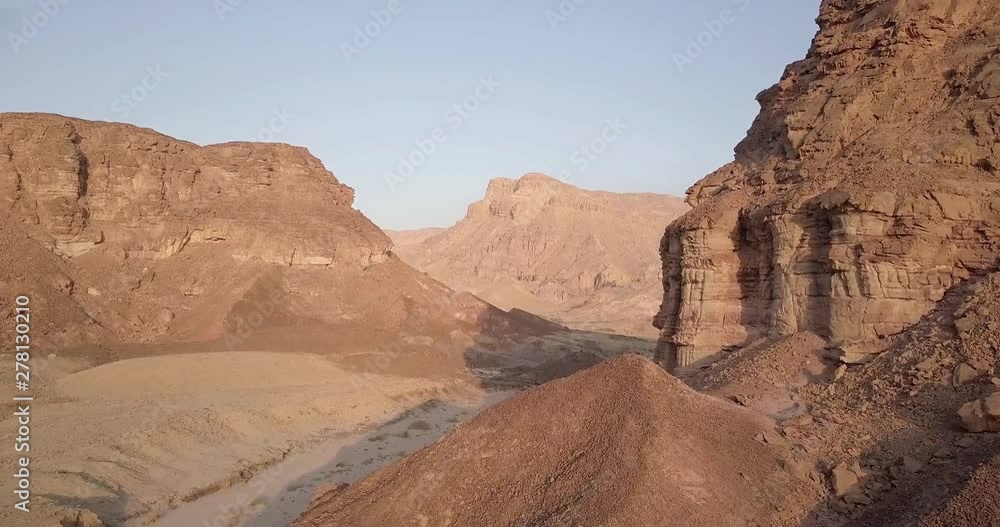 Flying over rocky desert mountains Aerial view of Rocky Desert Mountains in Sasgon Timna Valley, Negev, Arava, Israel Flying over rocky desert mountains Aerial view of Rocky Desert Mountains in Sasgon Timna Valley, Negev, Arava, Israel