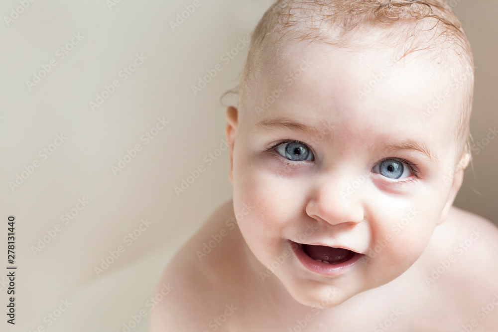 Blue eyed baby looking at camera with wonder in his eyes Blue eyed baby looking at camera with wonder in his eyes