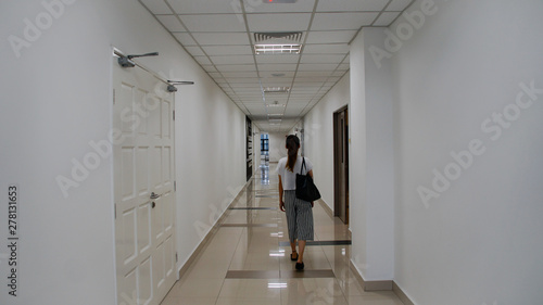 Likas, Malaysia, May 15, 2019: Young asian women walking in the building. photo