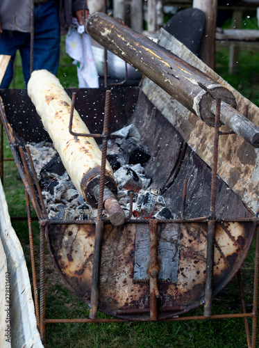 Traditional potato bread CHOCHOCA from Chiloe Island Chile prepared on wooden stick photo