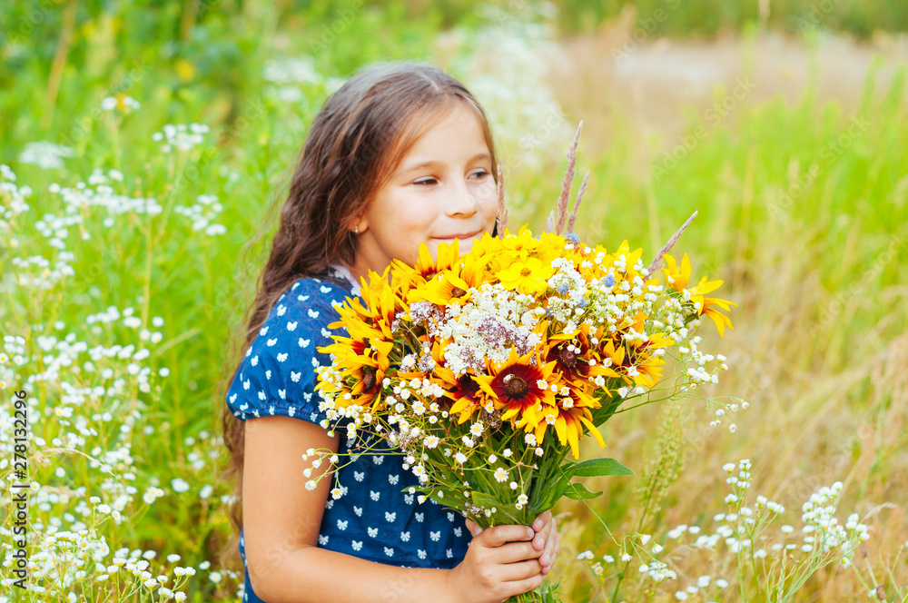 Little adorable girl gathered a bouquet of wild flowers Little adorable girl gathered a bouquet of wild flowers