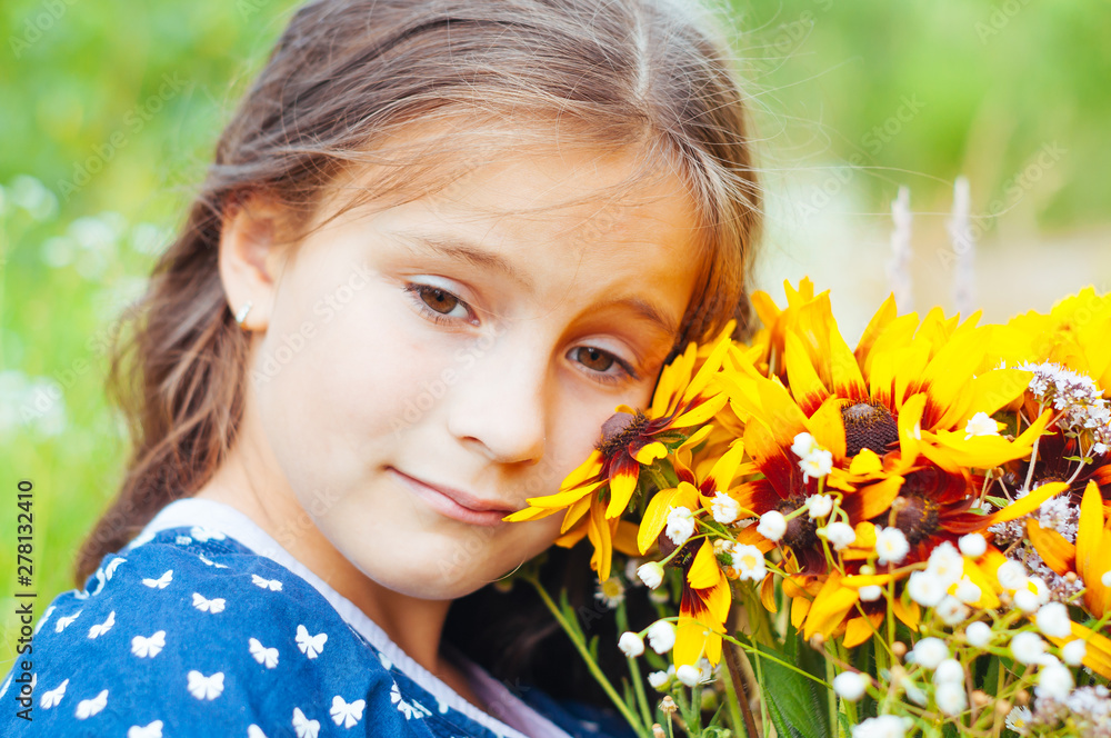 Little adorable girl gathered a bouquet of wild flowers Little adorable girl gathered a bouquet of wild flowers