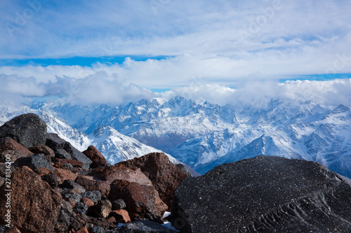 rocky snowy high peak in Russia.