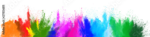 The explosion of multi colored powder. Beautiful rainbow color powder fly away. The cloud of glowing color powder on white background.
