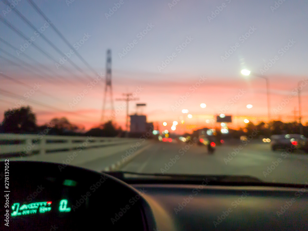 abstract bokeh of light on the highway road at sunset