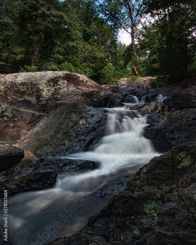 Waterfall over rocks background - vertical