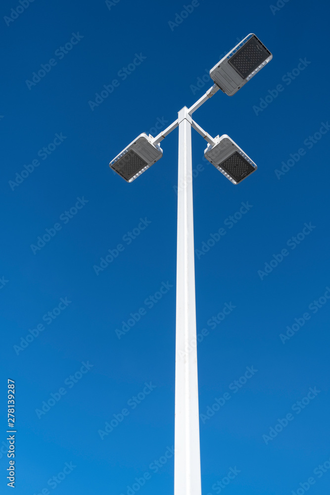 LED lighting pole against the clear blue sky on a street LED lighting pole against the clear blue sky on a street
