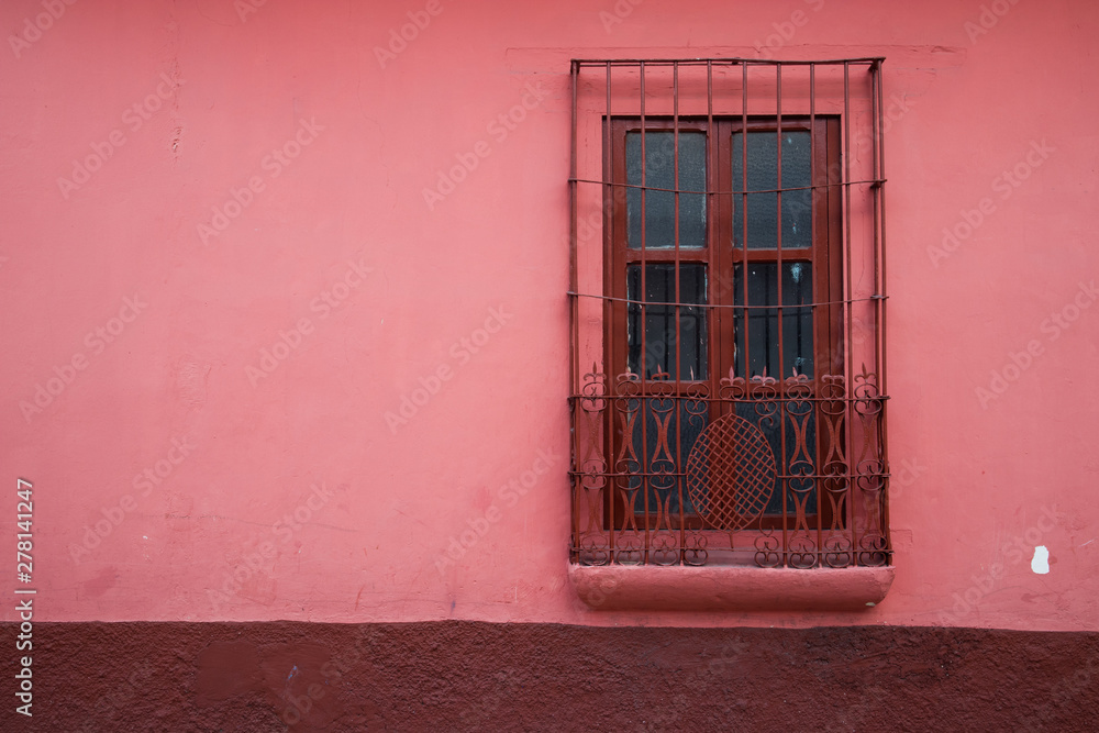 Fototapeta premium Red Window on Pink Wall of Building in Chiapas, Mexico