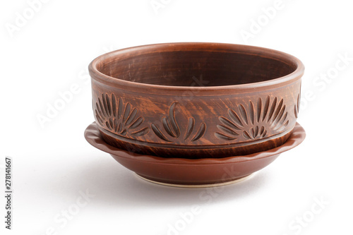 Beautiful clay bowl with patterns on white background