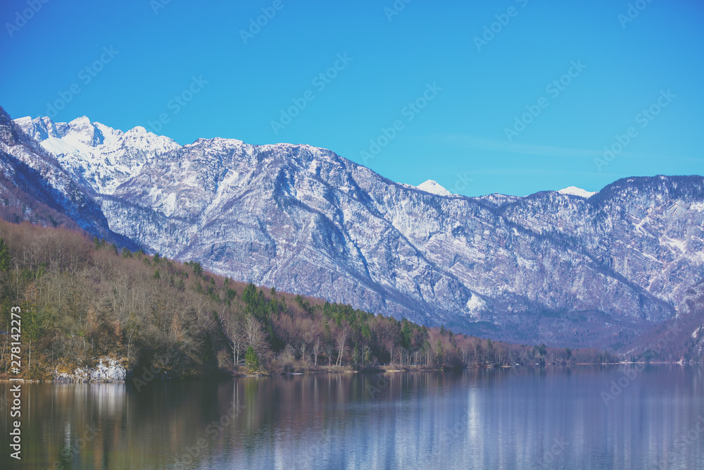 Mountain lake on a sunny day. Lake Bohinj (Bohinjsko jezero), Slovenia, Europe