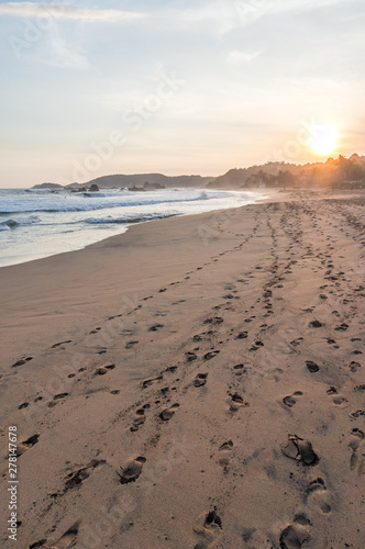 Tropical beach at sunset at the Pacific Ocean