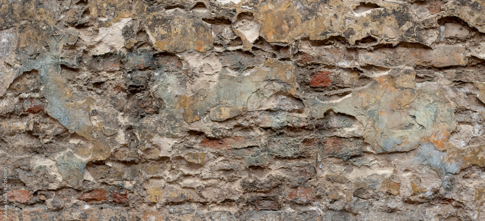 Old brick wall with peel stucco texture. Retro vintage worn wall background. Decayed cracked rough abstract wall surface Old brick wall with peel stucco texture. Retro vintage worn wall background. Decayed cracked rough abstract wall surface
