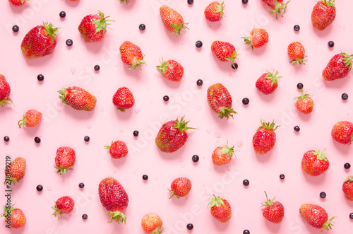 Strawberry and blueberry on pink background. Flat lay, top view. - Image