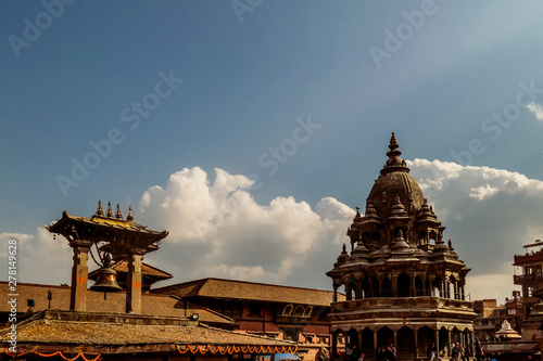 Bhaktapur Durbar Square Bell, Kathmandu, Nepal. A temple complex including an open air bell with cloud formation in the background. Concept of faith, consistency and spirituality. photo