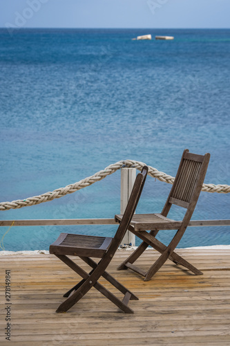 Wooden chairs on a deck platform